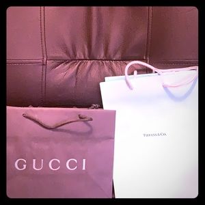 2 Gucci and 2 Tiffany paper shopping bags